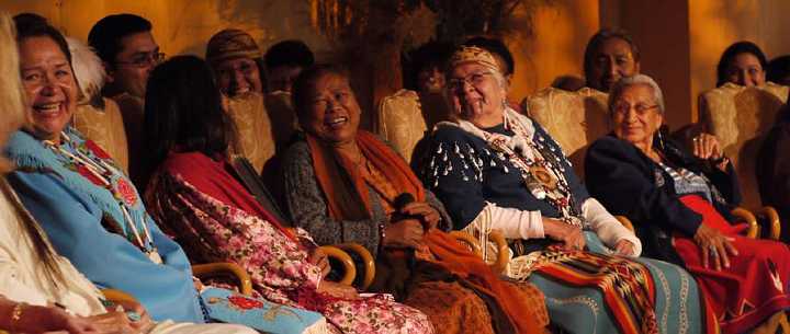 10 happy Grandmothers.jpg - 10 November 2010Members of the International Council of the Thirteen Indigenous Grandmothers from the Hopi/Havasupai/Tewa Nation, Arizona, USA; the Tamang tribe in Nepal; the Takelma Siletz Nation in Oregon, USA; and the Oglala Lakota Nation in South Dakota, USA. Behind them are their sons and daughters who assist with translation.